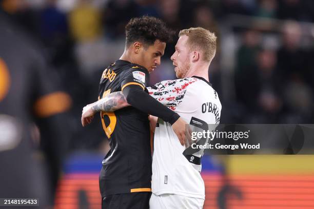 Fabio Carvalho of Hull City clashes with Lewis O'Brien of Middlesbrough during the Sky Bet Championship match between Hull City and Middlesbrough at...