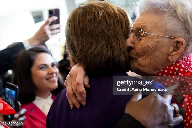 Rosie" Mae Krier kisses Rep. Nancy Pelosi's cheek after a Congressional Gold Medal Ceremony for the "Rosie the Riveter" women at the U.S. Capitol on...