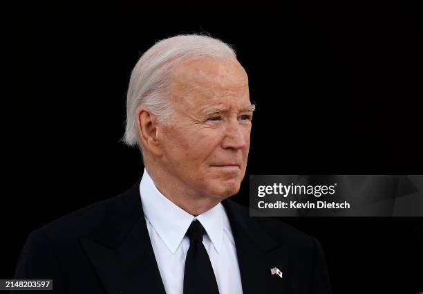 President Joe Biden waits to welcome Japanese Prime Minister Fumio Kishida and his wife Yuko Kishida to the White House for a state dinner on April...