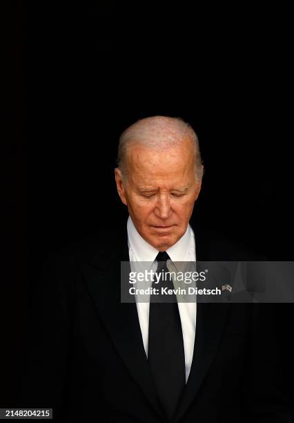 President Joe Biden waits to welcome Japanese Prime Minister Fumio Kishida and his wife Yuko Kishida to the White House for a state dinner on April...