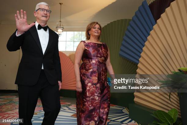 Apple CEO Tim Cook and Apple Vice President Lisa Jackson arrive at the White House for a state dinner on April 10, 2024 in Washington, DC. U.S....