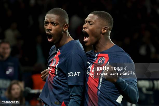 Ousmane Dembele of PSG celebrates his goal with Nuno Mendes during the UEFA Champions League quarter-final first leg match between Paris...