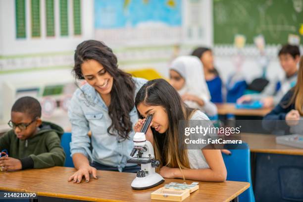 taking a closer look - elementary school age children stock pictures, royalty-free photos & images