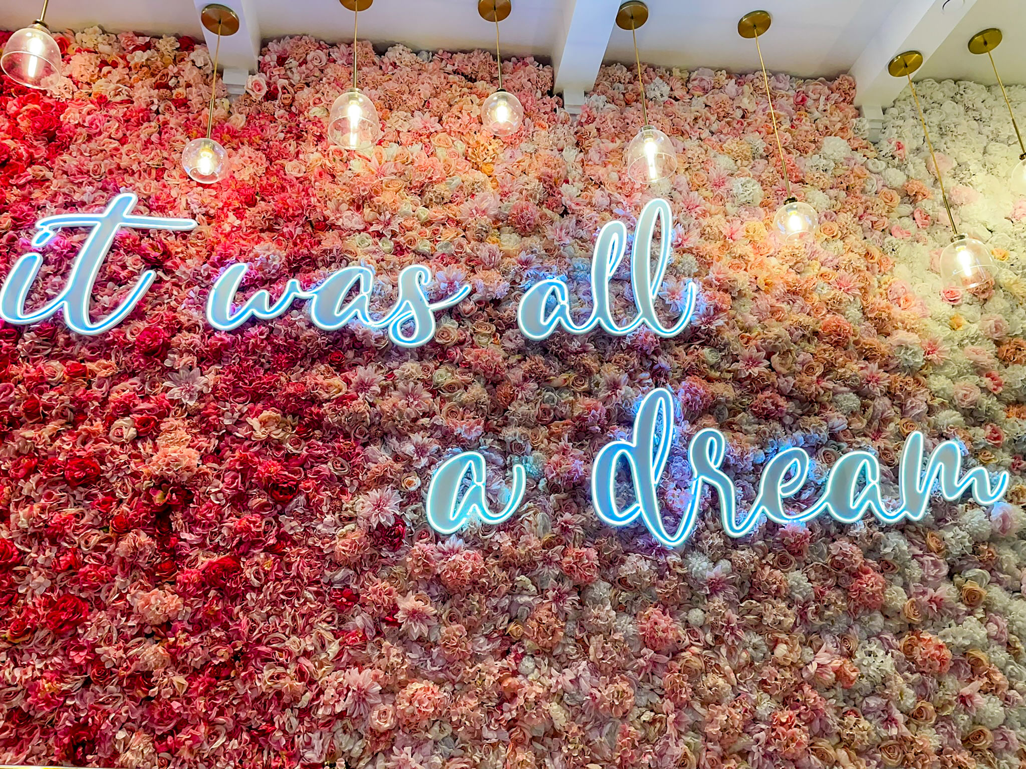 It was all a dream slogan sign on a colorful flower wall It was all a dream slogan sign on a colorful flower wall