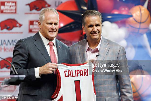 New head coach John Calipari of the Arkansas Razorbacks poses with Athletic Director Hunter Yurachek as he is introduced to the fans and the media at...