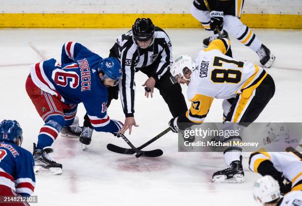 Sidney Crosby of the Pittsburgh Penguins takes a first period faceoff against Vincent Trocheck of the New York Rangers at Madison Square Garden on...