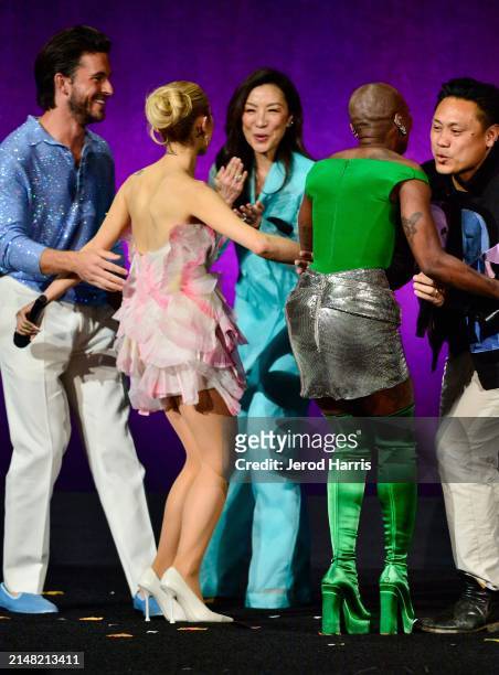 Jonathan Bailey, Ariana Grande, Michelle Yeoh, Cynthia Erivo, and Jon M. Chu speak onstage during the Universal Pictures and Focus Features Special...