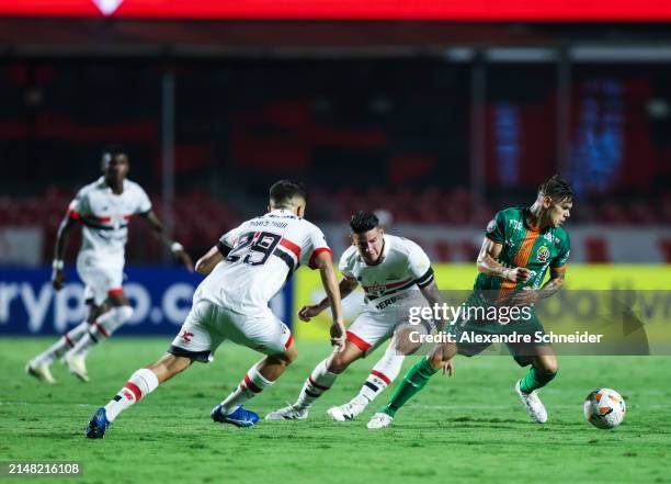 James Rodrigues of Sao and Franco Garcia of Cobresal fight for the ball during a Group B match between Sao Paulo and Cobresal as part of Copa...