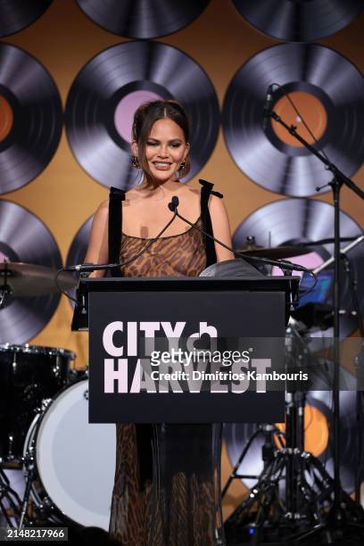 Chrissy Teigen speaks onstage as City Harvest Presents The 2024 Gala: Magic Of Motown at Cipriani 42nd Street on April 10, 2024 in New York City.