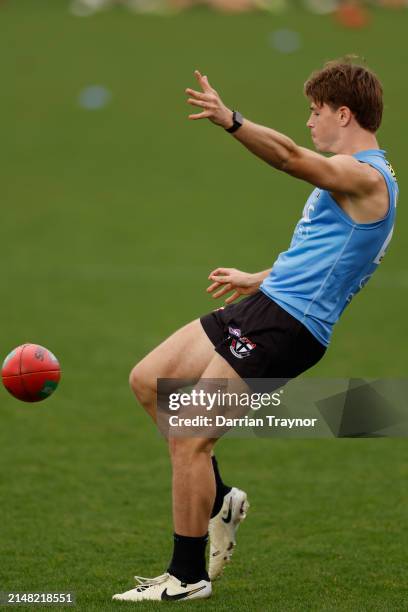 Mattaes Phillipou of the Saints kicks the ball during a St Kilda Saints AFL training session at RSEA Park on April 11, 2024 in Melbourne, Australia.