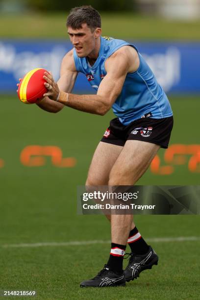 Tom Campbell of the Saints marks the ball during a St Kilda Saints AFL training session at RSEA Park on April 11, 2024 in Melbourne, Australia.