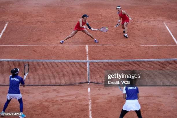 Guo Hanyu and Wang Xiyu of China compete in the Women's Doubles match against Rutuja Bhosale and Prarthana G Thombare of India during the Billie Jean...