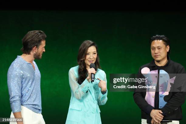 Jonathan Bailey, Michelle Yeoh and Jon M. Chu speak onstage during the Universal Pictures and Focus Features Presentation during CinemaCon 2024 at...