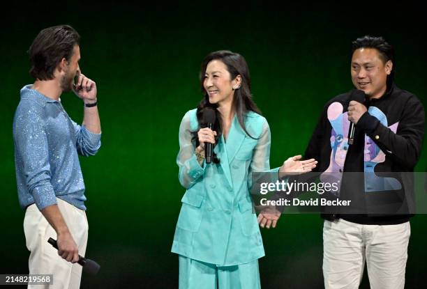 Jonathan Bailey, Michelle Yeoh and Jon M. Chu speak onstage during the Universal Pictures and Focus Features Presentation during CinemaCon 2024 at...