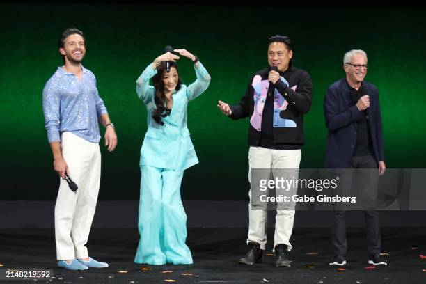 Jonathan Bailey, Michelle Yeoh, Jon M. Chu and Marc E. Platt speak onstage during the Universal Pictures and Focus Features Presentation during...