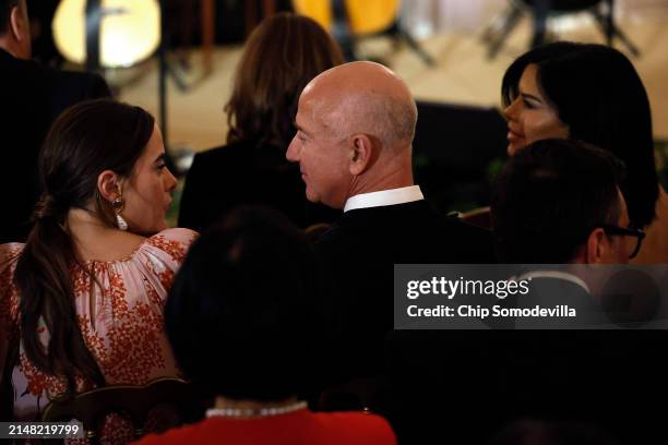 Naomi Biden talks with Jeff Bezos and Lauren Sanchez in the State Dining Room of the White House as U.S. President Joe Biden and first lady Jill...