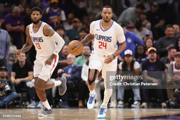 Norman Powell of the LA Clippers handles the ball during the second half of the NBA game at Footprint Center on April 09, 2024 in Phoenix, Arizona....