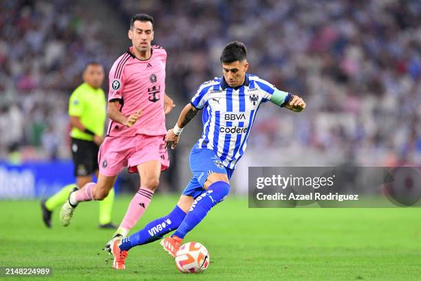 Maximiliano Meza of Monterrey controls the ball while defended by Sergio Busquets of Inter Miami in the second half during the CONCACAF Champions Cup...