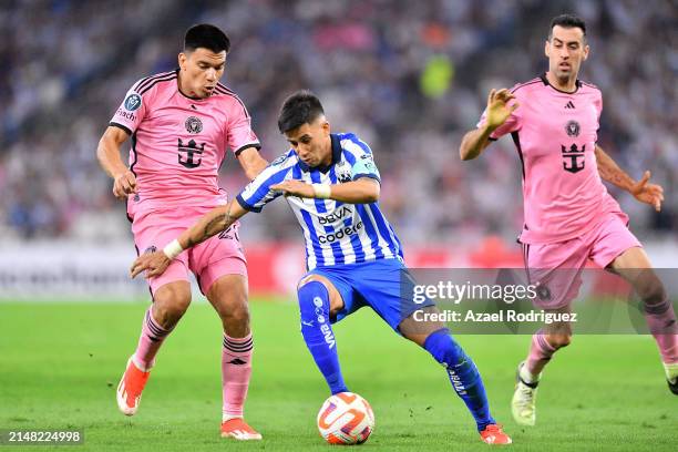 Maximiliano Meza of Monterrey controls the ball while defended by Sergio Busquets of Inter Miami in the second half during the CONCACAF Champions Cup...