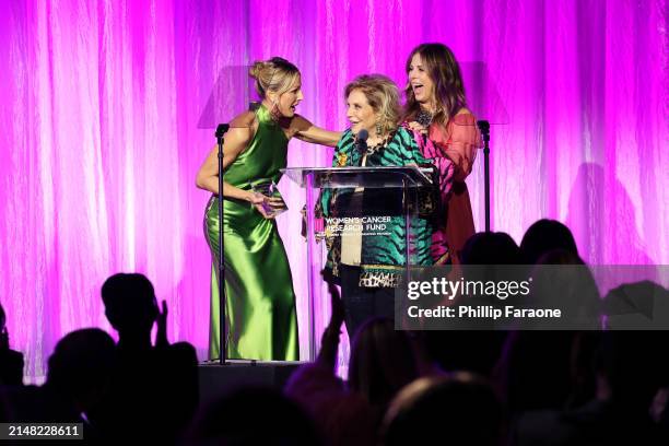 Honoree Wallis Annenberg accepts the Unsung Hero Award from Jamie Alexander Tisch and Rita Wilson onstage during "An Unforgettable Evening"...