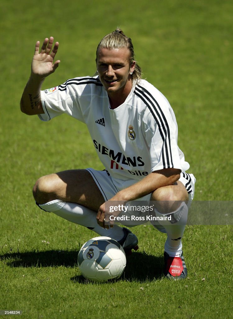 Beckham Real David Beckham shows off his new shirt as he signs for Real Madrid for ...