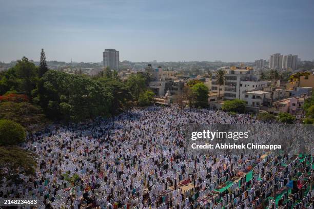 Muslims perform Eid al-Fitr prayers in a public playground on April 11, 2024 in Bengaluru, India. Muslims worldwide observe the Eid Al-Fitr prayer to...