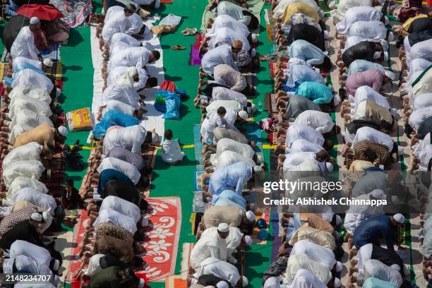 Muslims perform Eid al-Fitr prayers in a public playground on April 11, 2024 in Bengaluru, India. Muslims worldwide observe the Eid Al-Fitr prayer to...