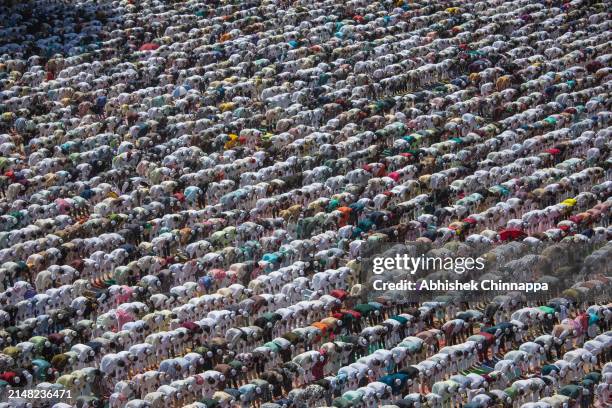 Muslims perform Eid al-Fitr prayers in a public playground on April 11, 2024 in Bengaluru, India. Muslims worldwide observe the Eid Al-Fitr prayer to...