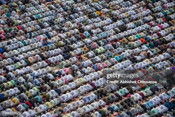 Muslims perform Eid al-Fitr prayers in a public playground on April 11, 2024 in Bengaluru, India. Muslims worldwide observe the Eid Al-Fitr prayer to...