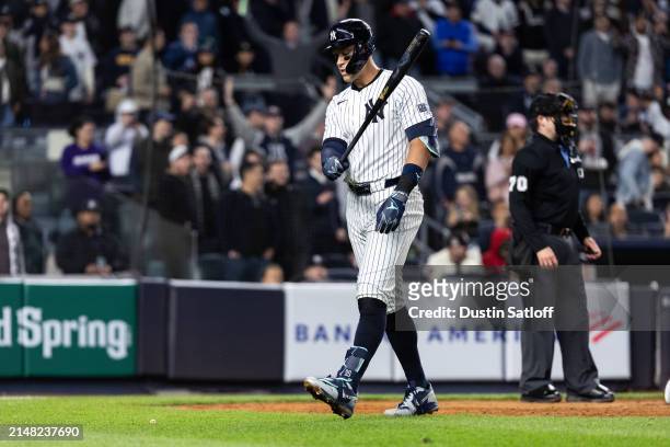 Aaron Judge of the New York Yankees reacts after striking out during the eighth inning of the game against the Miami Marlins at Yankee Stadium on...