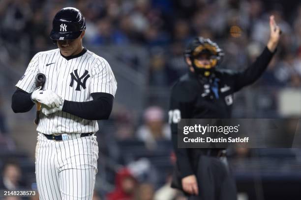 Juan Soto of the New York Yankees adjusts his batting gloves during an at bat during the fifth inning of the game against the Miami Marlins at Yankee...