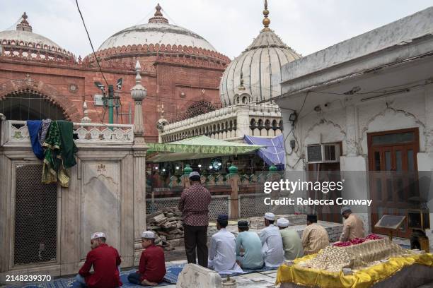 Muslims prepare to perform Eid Al-Fitr prayers at the Hazrat Nizamuddin Dargah on April 11, 2024 in Delhi, India. Muslims worldwide observe the Eid...