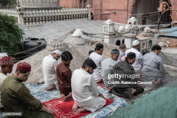 Muslims perform Eid Al-Fitr prayers at the Hazrat Nizamuddin Dargah on April 11, 2024 in Delhi, India. Muslims worldwide observe the Eid Al-Fitr...