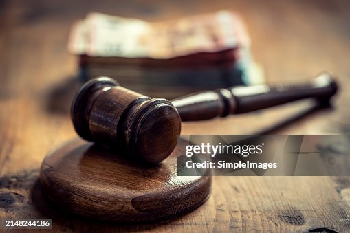Corruption in the judiciary, the judge's gavel and euro banknotes in an envelope. Corruption in the judiciary, the judge's gavel and euro banknotes in an envelope.