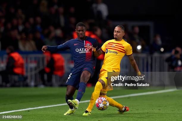 P2 of Paris Saint-Germain competes for the ball with Raphinha of FC Barcelona during the UEFA Champions League quarter-final first leg match between...