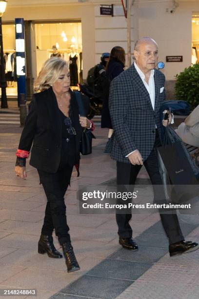 Carmen Borrego and her husband, Jose Carlos Bernal, take a walk after going shopping on April 10 in Madrid, Spain.