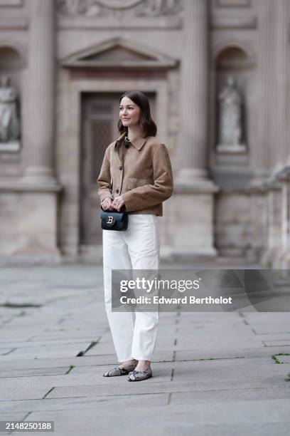Marissa Cox wears a Massimo Dutti brown suede jacket, Citizens of Humanity cream cargo pants, Arket snake print ballerina flats, a Balmain black bag,...
