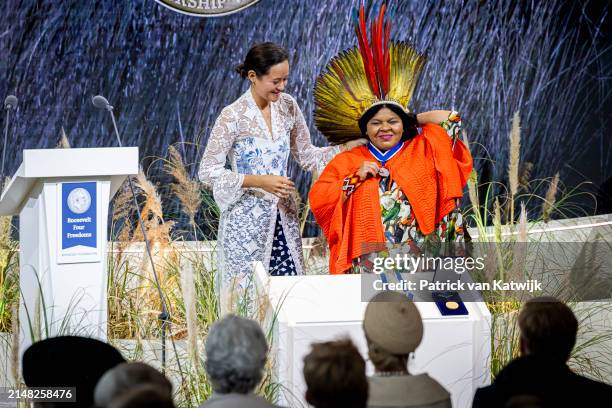 Brazilian minister Sonia Guajajara of Indigenous peoples receives the award from Melati Wijsen at the Four Freedom Award Ceremony at the Abbey on...