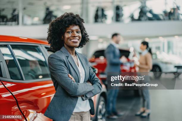 the heart of the showroom - car salesperson stock pictures, royalty-free photos & images