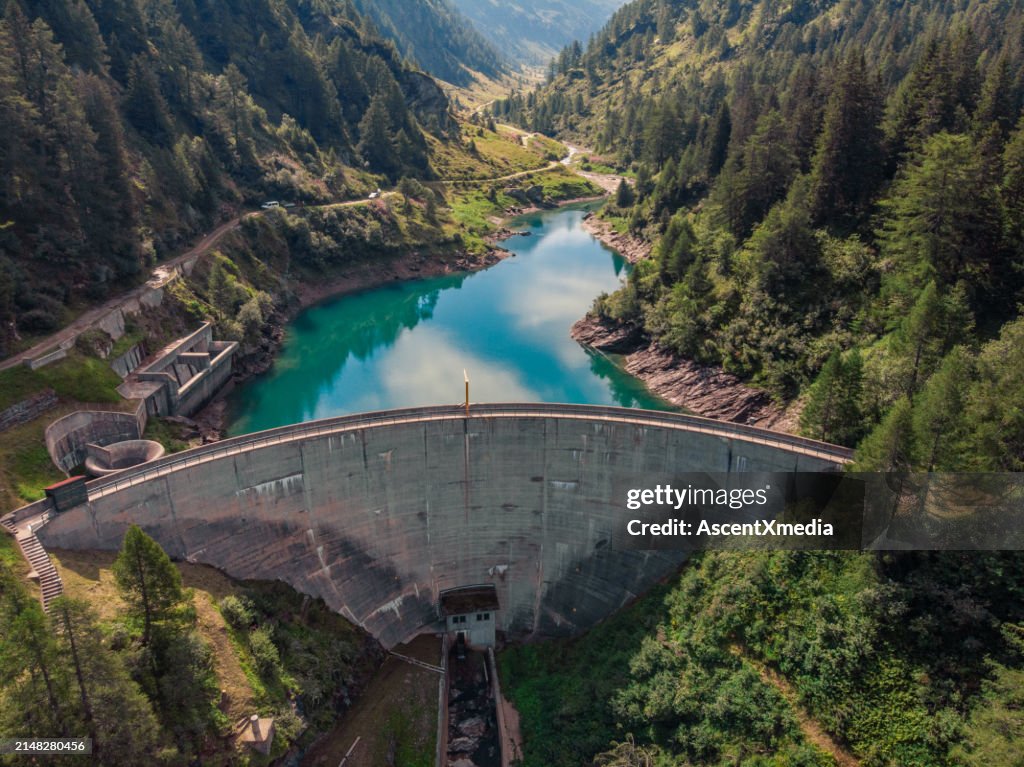 Aerial view of dam and reservoir in mountains