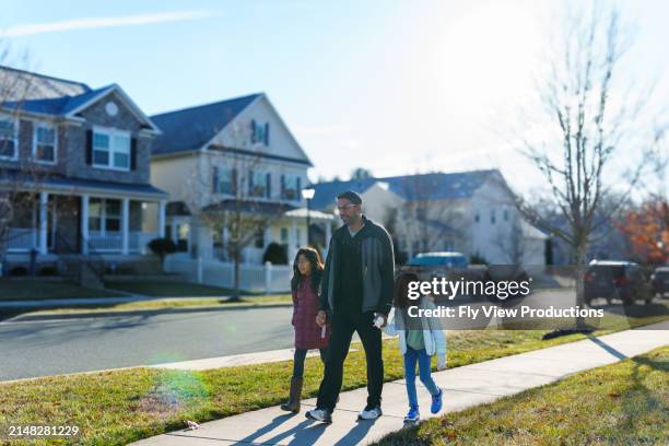 father walks his school aged daughters to school - indian truck stock pictures, royalty-free photos & images