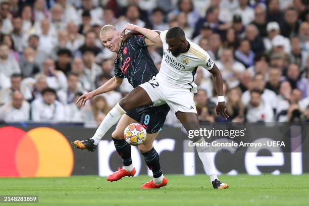 Erling Haaland of Manchester City FC competes for the ball with Antonio Rudiger of Real Madrid CF during the UEFA Champions League quarter-final...