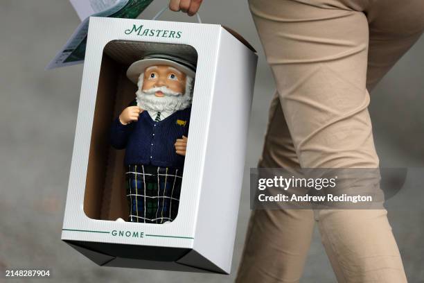 Patron holds a Masters Gnome during the first round of the 2024 Masters Tournament at Augusta National Golf Club on April 11, 2024 in Augusta,...