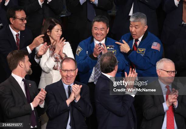 Astronaut Daniel Tani and Akihiko Hoshide stand as they are recognized by Japanese Prime Minister Fumio Kishida as he addresses a joint meeting of...