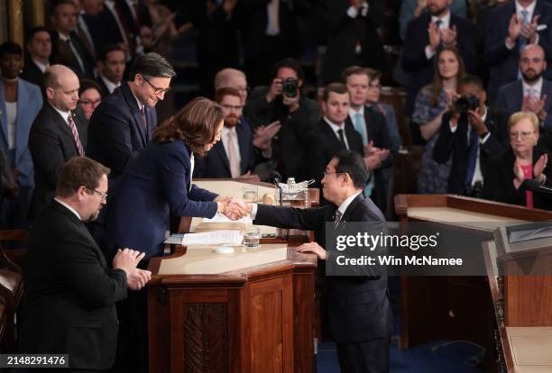 Japanese Prime Minister Fumio Kishida shakes hands with U.S. Vice President Kamala Harris and U.S. Speaker of the House Mike Johnson after he...