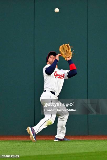 Center fielder Ramón Laureano of the Cleveland Guardians catches a fly ball hit by Dominic Fletcher of the Chicago White Sox during the sixth inning...