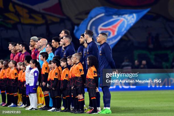 Paris Saint-Germain players line up before the UEFA Champions League quarter-final first leg match between Paris Saint-Germain and FC Barcelona at...