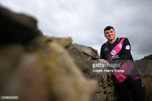 Tom Banton of Somerset poses for a photo at Valley of the Rocks on April 03, 2024 in Lynton and Lynmouth, England.