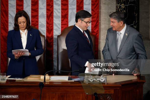 Speaker of the House Mike Johnson talks with Sen. Joe Manchin as Vice President Kamala Harris stands by after Japanese Prime Minister Fumio Kishida...