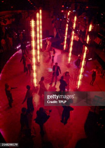 An above angle of people dancing at the Manhattan nightclub and disco Studio 54 in New York, New York, circa 1979.